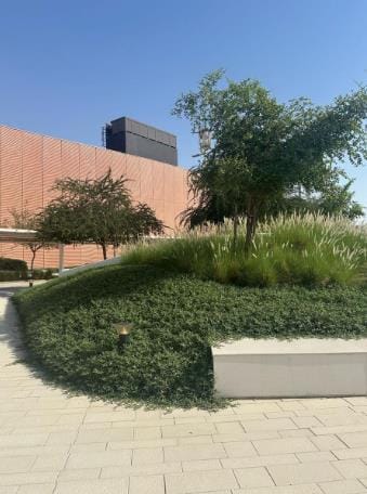 A planted mound with a seat wall