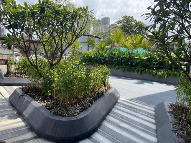 A curved planter on the podium