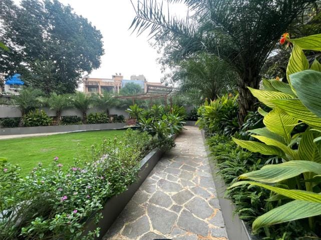 A stone path beside the lawn