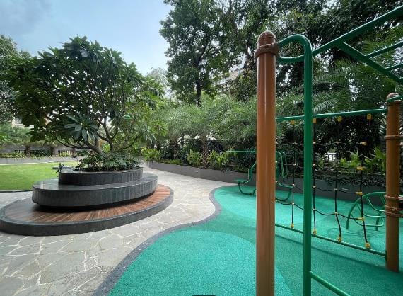 The play area beside the tree seat