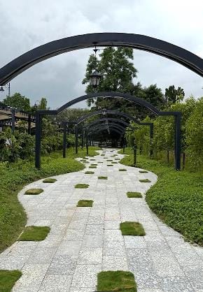 Steel arches over a paved walk